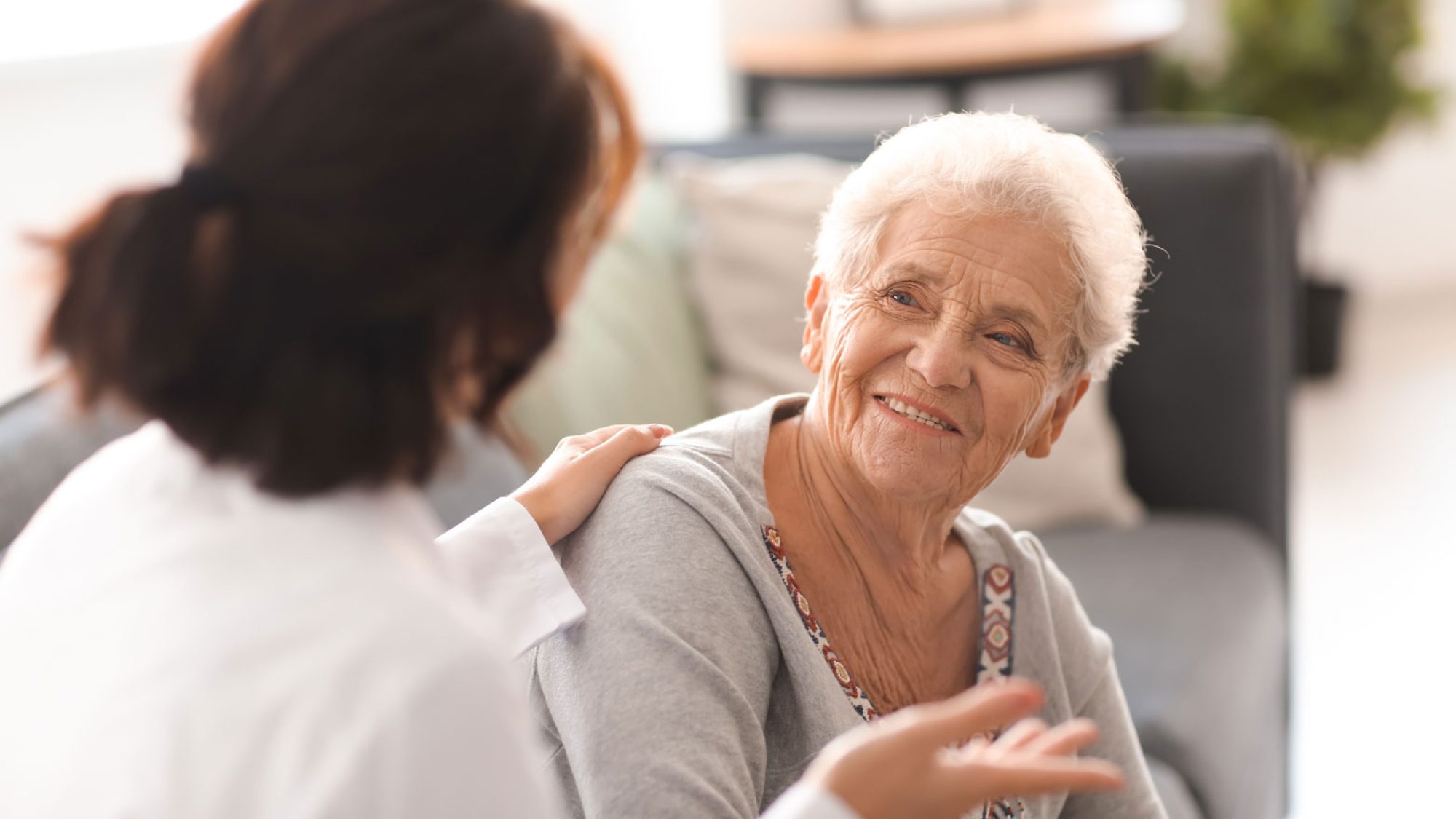 An older woman talking with her doctor
