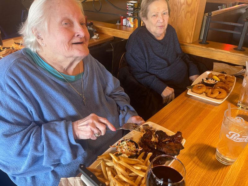 Residents enjoy an outing to a local restaurant.