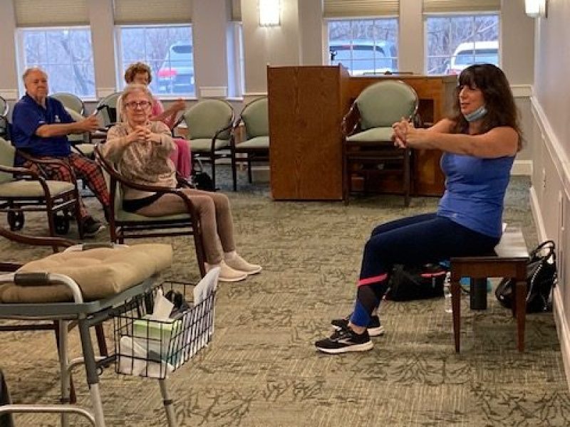 Residents in Peabody enjoy exercise class.