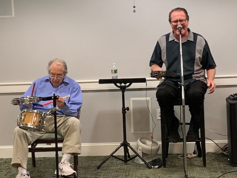 Resident Manny Gassman accompanies entertainer Jimmy Honohan on the drums. In his youth, Manny had his own band “Manny Gassman Orchestra,“ playing at weddings and Bar Mitzvahs. Manny, you’ve still got it!!