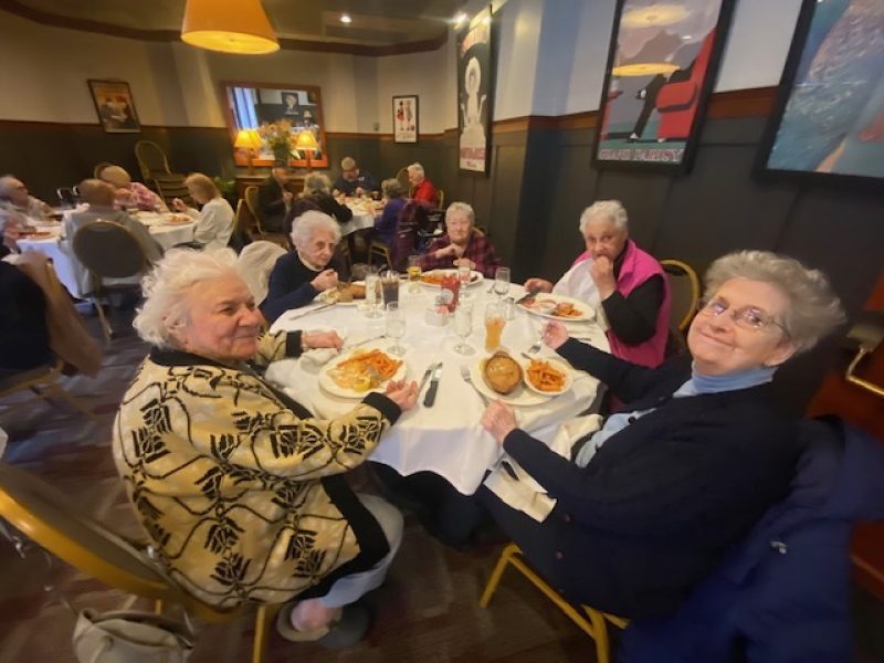 Residents enjoy a meal out at a restaurant.