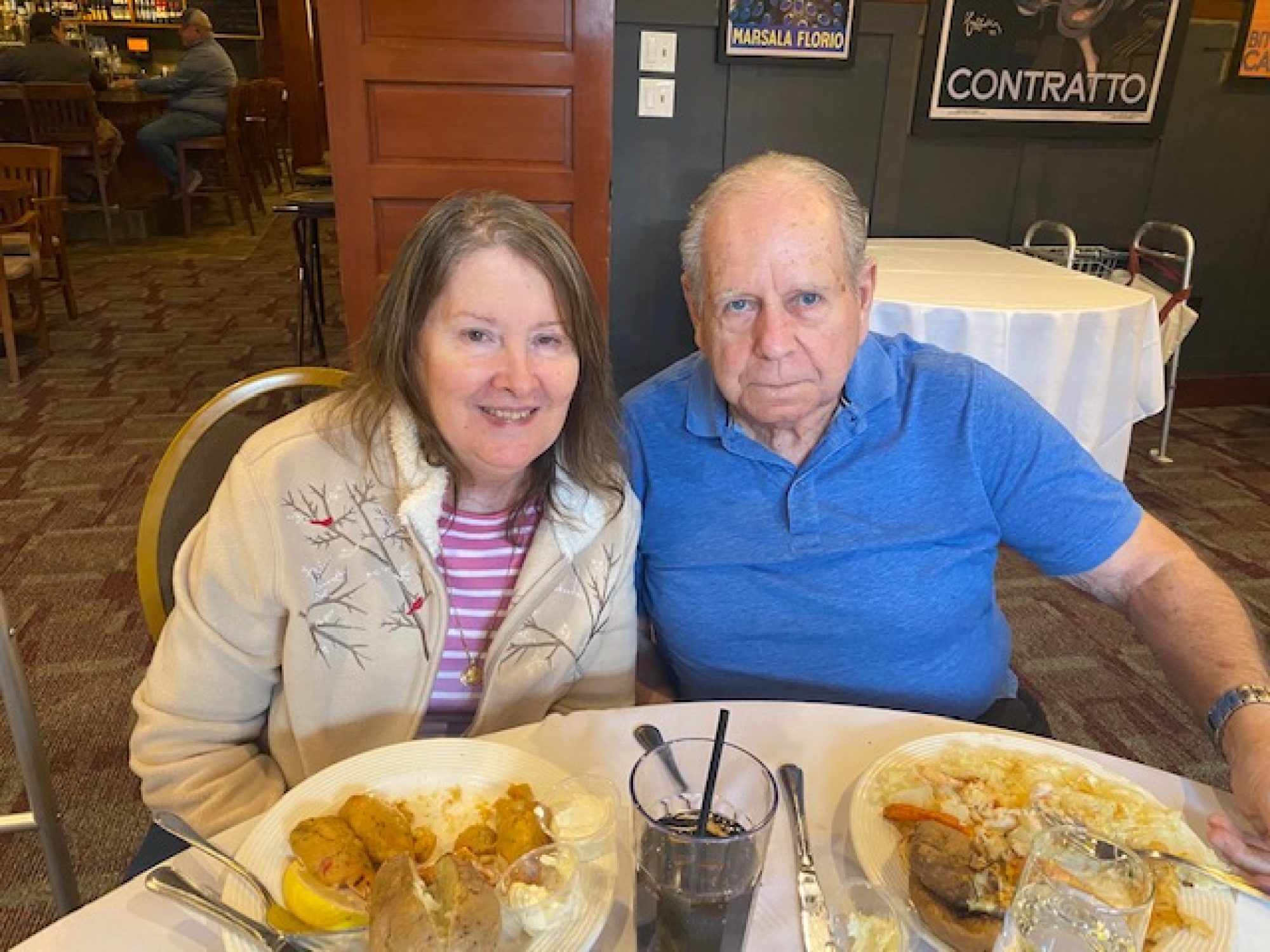 A couple, who are residents, enjoy a meal out.