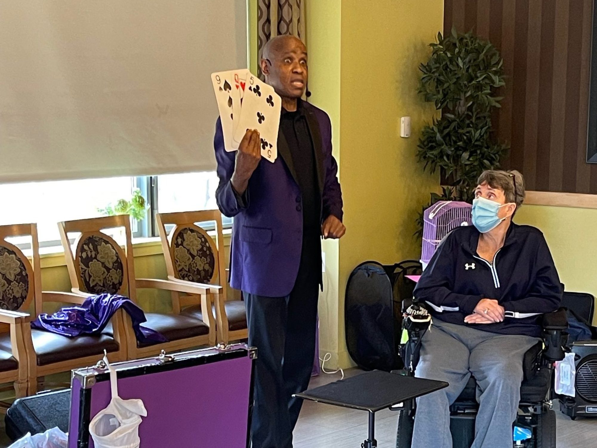 Residents of Leonard Florence Center for Living enjoy a magic show.