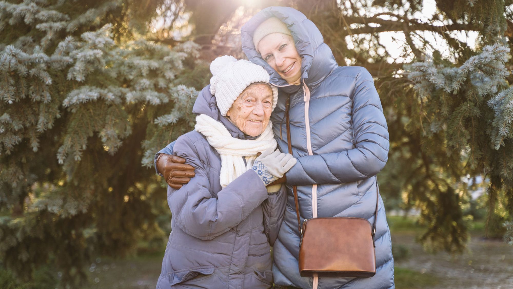 Two ladies bundled up outside in the winter